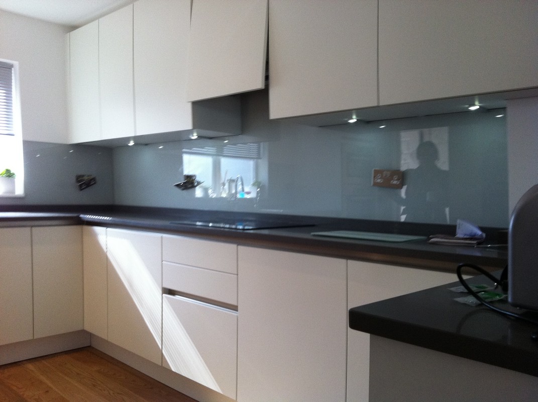 Grey glass kitchen splashback with LED lighting in Cobham