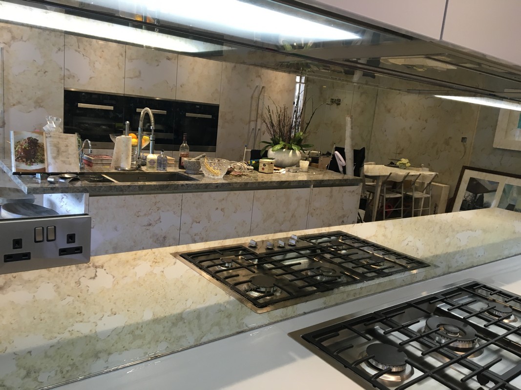 Mirror glass splashback in Cobham luxury kitchen