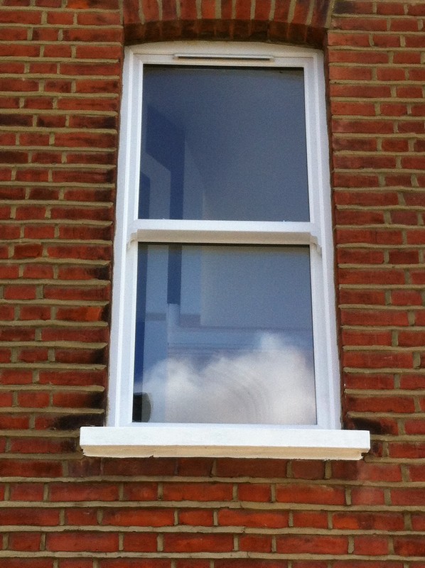 uPVC sash window on Victorian red brick house in Cobham